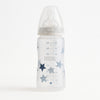 NUK Babyflasche 300 ml mit beigem Schraubring und Sternen-Dekor; PP BPA-frei, First Choice+ System, Silikon-Trinksauger Größe M 0–6 Monate für Milchnahrung; auslaufsicher, gut ablesbare Skala – geeignet ab Geburt, schönes Geschenk zur Geburt.