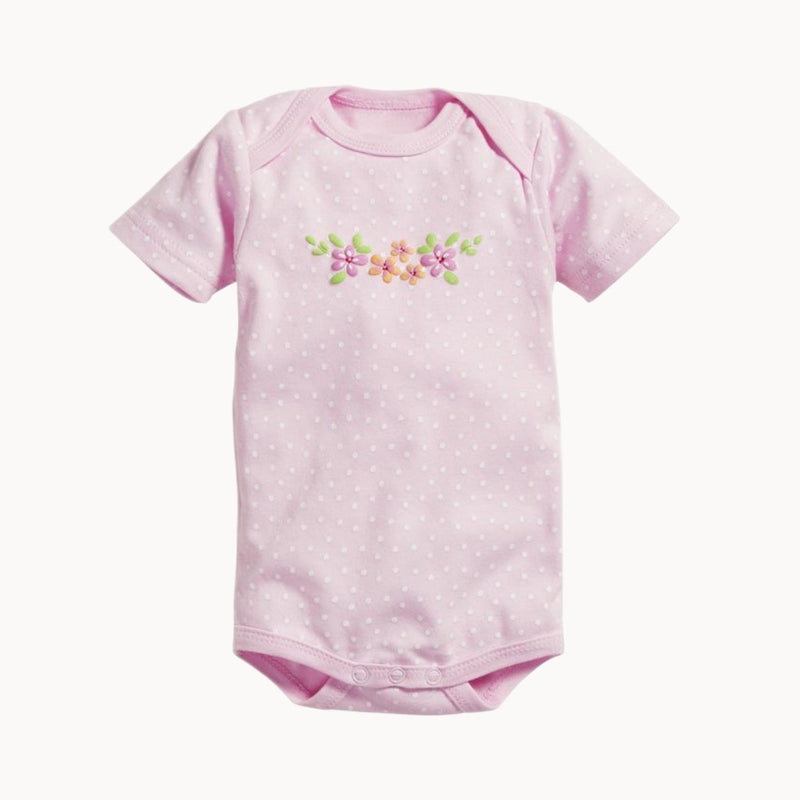 Schnizler Babybody kurzarm in Rosa mit feinem Pünktchenmuster und Blumenprint, 100 % Baumwolle, weich und atmungsaktiv; amerikanischer Ausschnitt und Druckknöpfe im Schritt für einfaches An- und Ausziehen – Größe 50–56 cm.